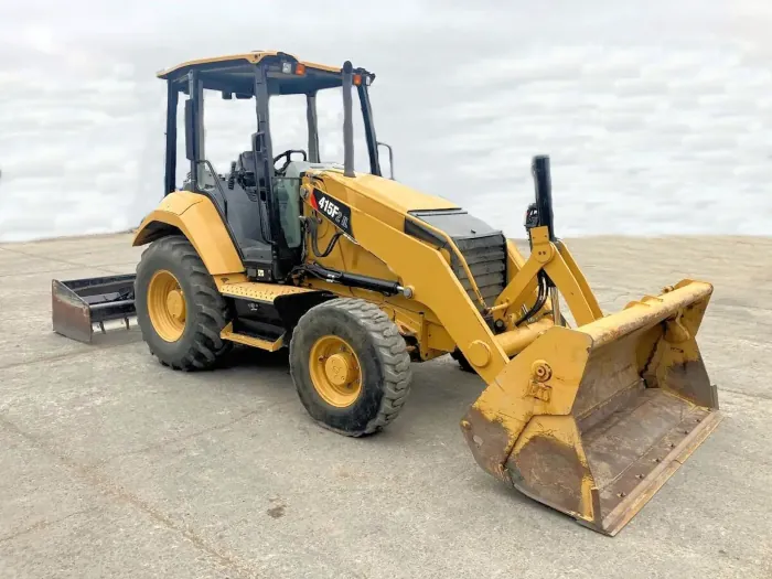 A yellow construction bulldozer with the the wording 415F on the side.