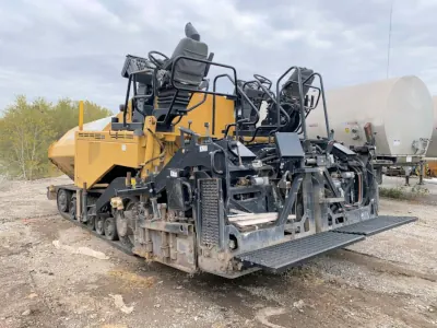 Massive yellow construction machinery with tracks and dual seating featured in the image.
